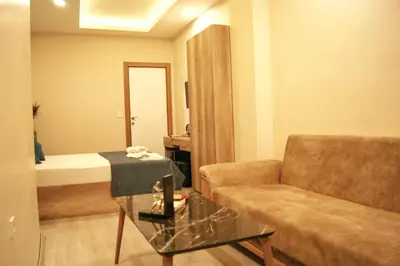 a living room with a couch and a table at Destinia Pera in Istanbul