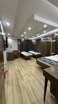 a large room with two beds and a couch at Han Suite Hotel in Istanbul