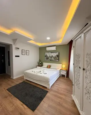 a bedroom with a large white bed in a room at GV Suites Galata in Istanbul
