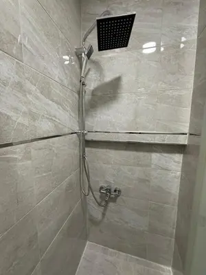 a shower stall with a shower head in a bathroom at GV Suites Galata in Istanbul