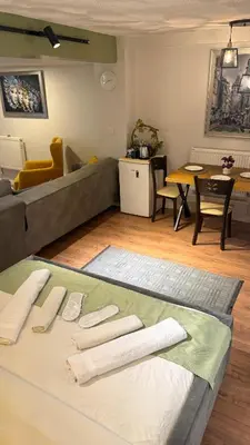 a living room with a couch and a table at GV Suites Galata in Istanbul