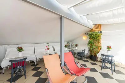 a restaurant with tables and chairs in a room at Istanbul Amedros Home in Istanbul