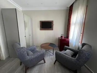 a living room with two chairs and a table at Cheers Lighthouse in Istanbul