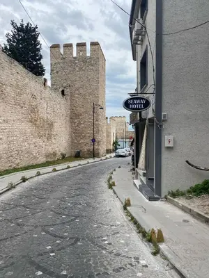 an empty street with a building and a castle at Seaway Hotel İstanbul in Istanbul