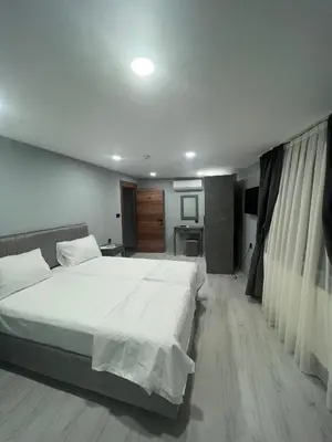a bedroom with a large white bed in it at Seaway Hotel İstanbul in Istanbul