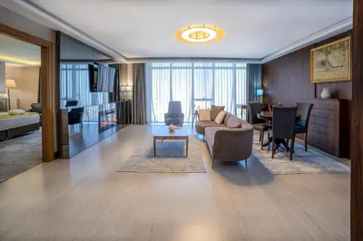 a living room with a couch and a table at Royal Termal Hotel in Bursa