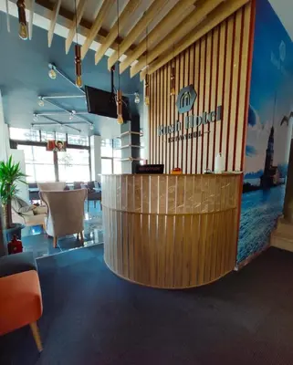 a restaurant with a wooden counter and a bar at RUSH HOTEL İSTANBUL in Istanbul