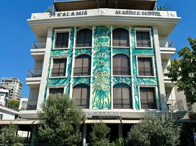 a building with a mural on the side of it at 39 Kalamış Marina Hotel & Restaurant in Istanbul