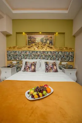 a plate of fruit on a bed in a hotel room at Atlantis Royal Hotel in Istanbul