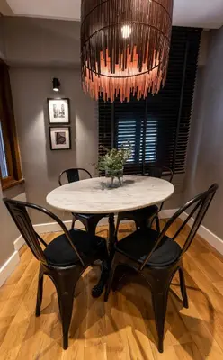 a dining room with a table and chairs under a chandelier at Bguest Pera Suites in Istanbul