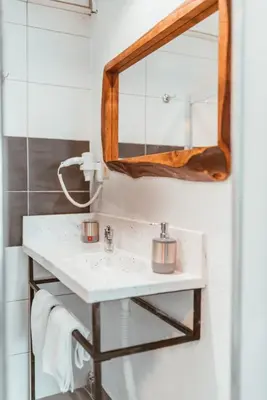 a bathroom with a sink and a mirror at PANDAN KARAKOY SUİT in Istanbul
