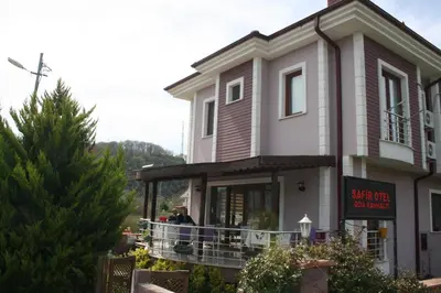 a building with people standing on a balcony at Sapphire Hotel in Agva