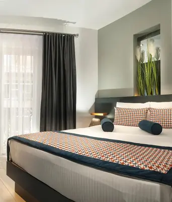 a bedroom with a large bed in front of a window at Ooda Rooms Kadıköy in Istanbul