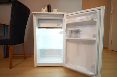 an empty refrigerator with its door open in a room at Zion Home Butik Otel in Istanbul