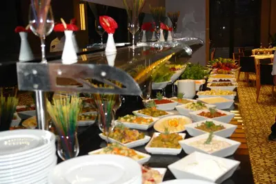 a buffet with many plates of food on a table at Istanbul Dora Hotel in Istanbul