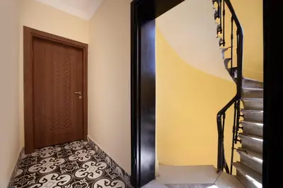 a hallway with a staircase and a door and a stair case at taxim cool in Istanbul