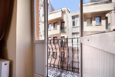 a balcony with a view of a building at taxim cool in Istanbul