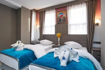 two beds in a hotel room with stuffed animals on them at Renzo Hotel - Special Category in Istanbul