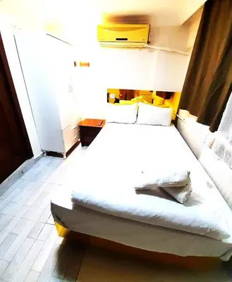 a bedroom with a large white bed in a room at Ozbekler Hotel-Old City in Istanbul