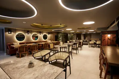 a restaurant with tables and chairs in a room at Avantgarde Urban Sisli in Istanbul