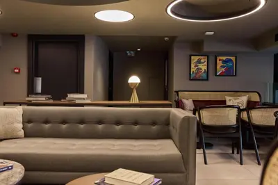 a waiting room with a couch and a table at Avantgarde Urban Sisli in Istanbul