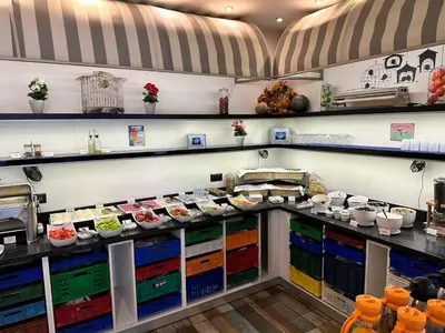 a kitchen with a counter with food on it at Tempo Suites Airport in Istanbul