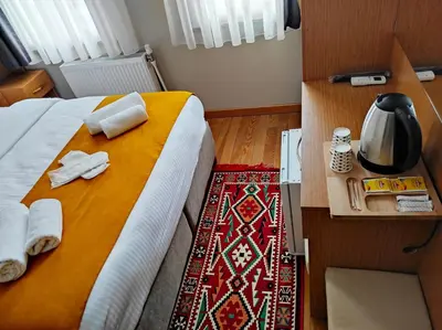 a hotel room with a bed with towels on it at Lebon Hotel-Special Class in Istanbul