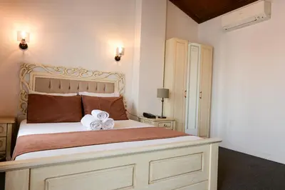 a bedroom with a bed with a flower on it at Galata Dream Hotel in Istanbul