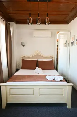a bedroom with a large bed with two towels on it at Galata Dream Hotel in Istanbul