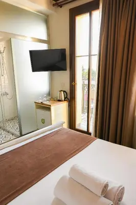 a hotel room with a bed and a large window at Galata Dream Hotel in Istanbul