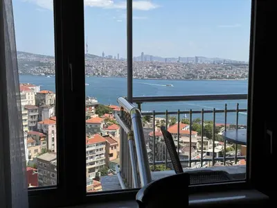 a window with a view of the water and buildings at Grand Star Hotel Premium in Istanbul