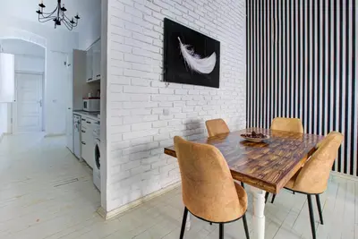 a dining room with a wooden table and chairs at Maravilloso Hotel Galata in Istanbul