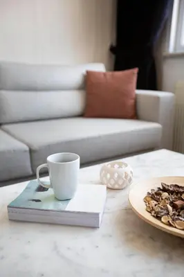a coffee cup and a plate of nuts on a table at Maravilloso Hotel Galata in Istanbul