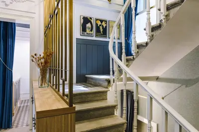 a staircase in a house with blue walls at The Soul Istanbul Hotel in Istanbul