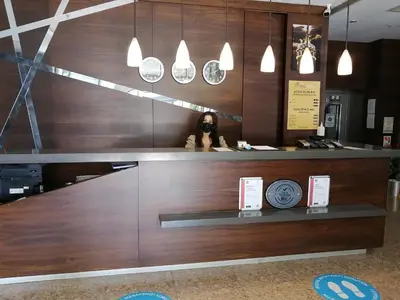 a woman sitting at a counter in a store at Nice Royal in Istanbul