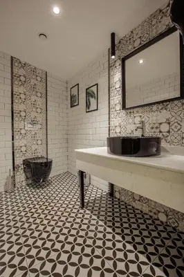 a bathroom with a large sink and a toilet at Kayhan City Hotel in Bursa