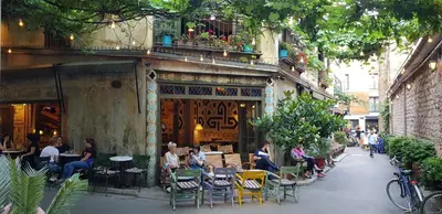 a group of people sitting outside of a restaurant at Casa Rosa Suites in Istanbul