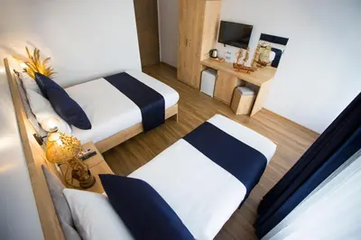 a hotel room with two beds and a television at Golden Street Hotel in Istanbul