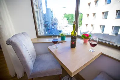 a bottle of wine and two glasses on a table at Golden Street Hotel in Istanbul