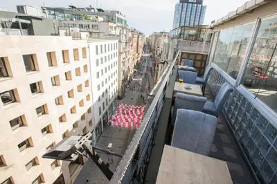 a balcony with chairs and tables on a building at Golden Street Hotel in Istanbul