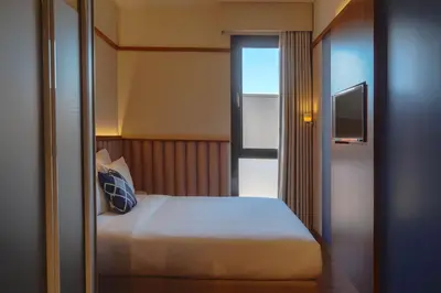 a hotel room with a bed and a television at Four Points Flex by Sheraton Bursa Nilüfer in Bursa