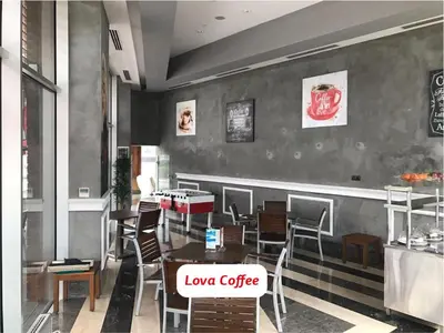 a restaurant with tables and chairs and a counter at Yalova Lova Hotel & SPA Yalova in Yalova