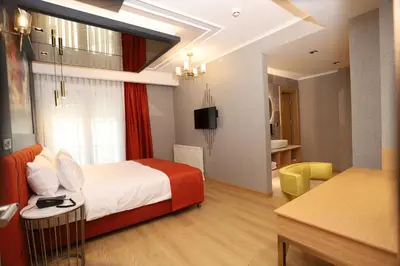 a hotel room with a bed and a bathroom at My Garden Hotel in Istanbul