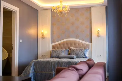 a bedroom with a bed with a couch in it at Thermal Saray Hotel & Yalova in Gokcedere
