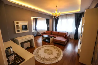 a living room with a couch and a table at Thermal Saray Hotel & Yalova in Gokcedere