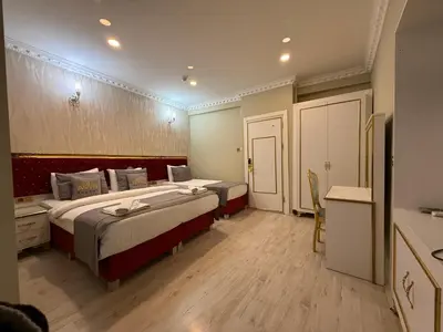 a hotel room with two beds and a bathroom at RHYTHM HOTEL in Istanbul