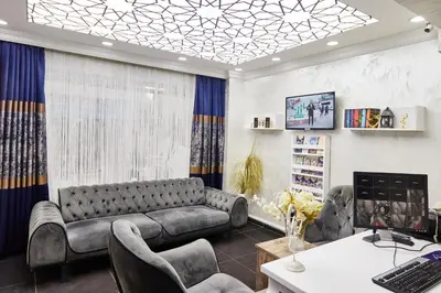 a living room with a couch and a desk at Armar Hotel in Istanbul