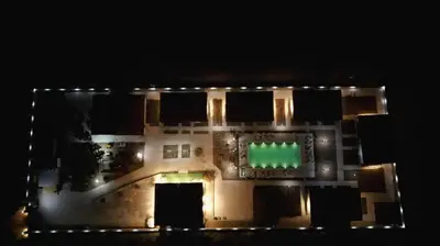 an aerial view of a building at night with lights at İğneada Hotel Rezve in Kırklareli