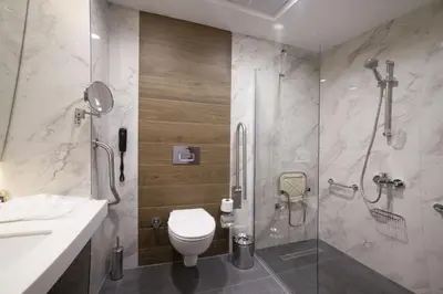 a bathroom with a shower and a toilet and a sink at GRANBELLAHOTEL in Tekirdag