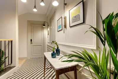 a hallway with a table and a potted plant at World House Boutique Hotel Galata in Istanbul